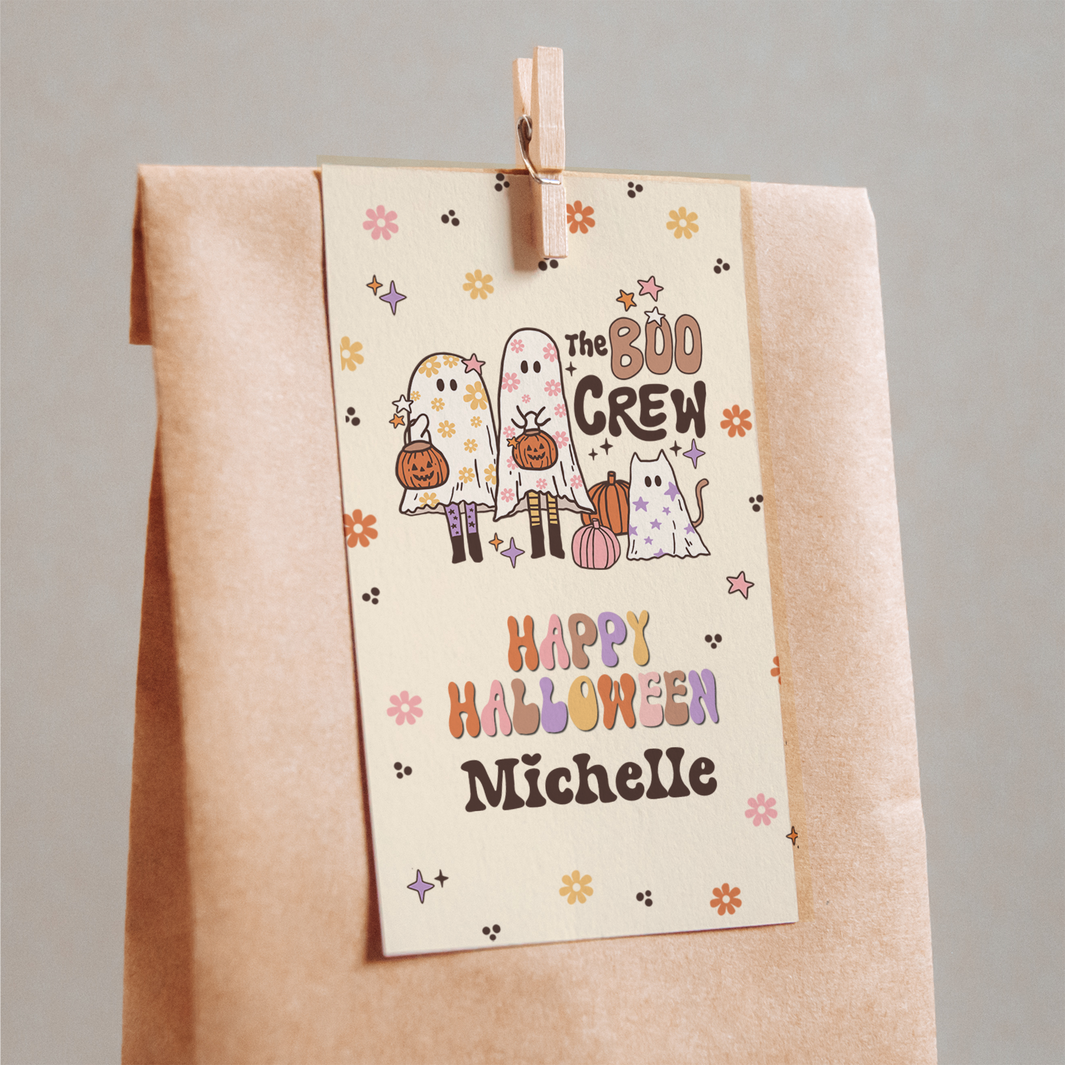 Halloween-themed paper bag with cartoon ghosts and pumpkins, featuring 'The Boo Crew' and 'Happy Halloween Michelle'.