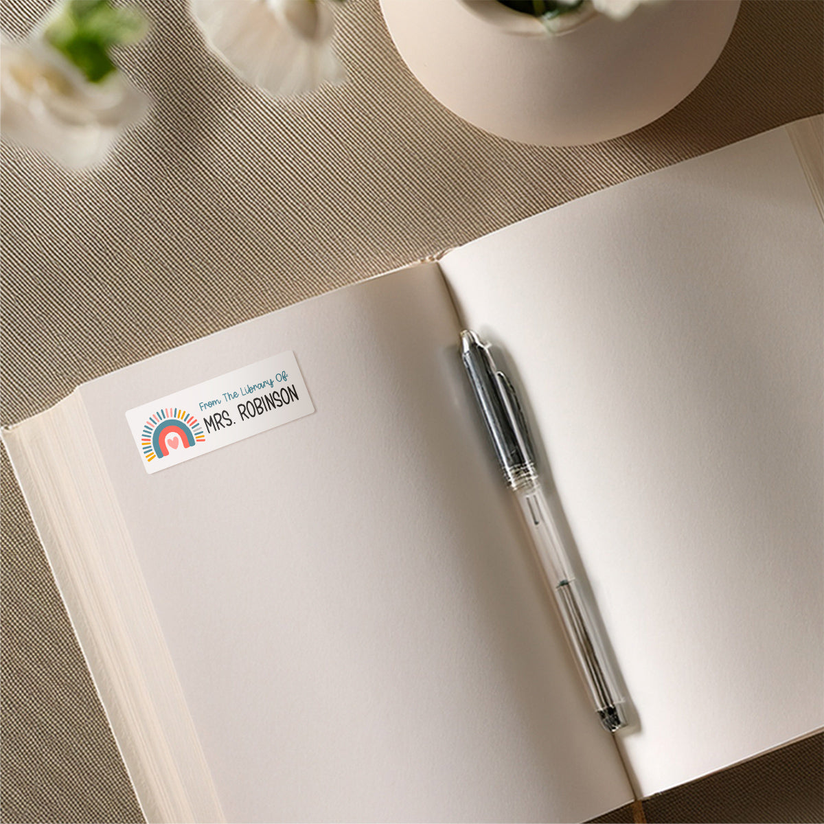 Colorful Boho Rainbow name sticker on book