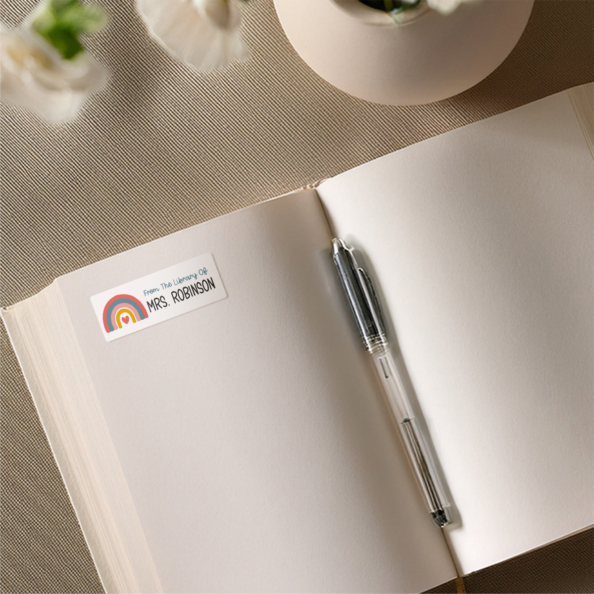 Colorful Boho Rainbow name sticker on book