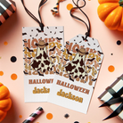 Two Halloween-themed gift tags with cow design and personalized text on a festive background.