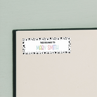 Spotted Border Name Stickers on beige inside cover of book