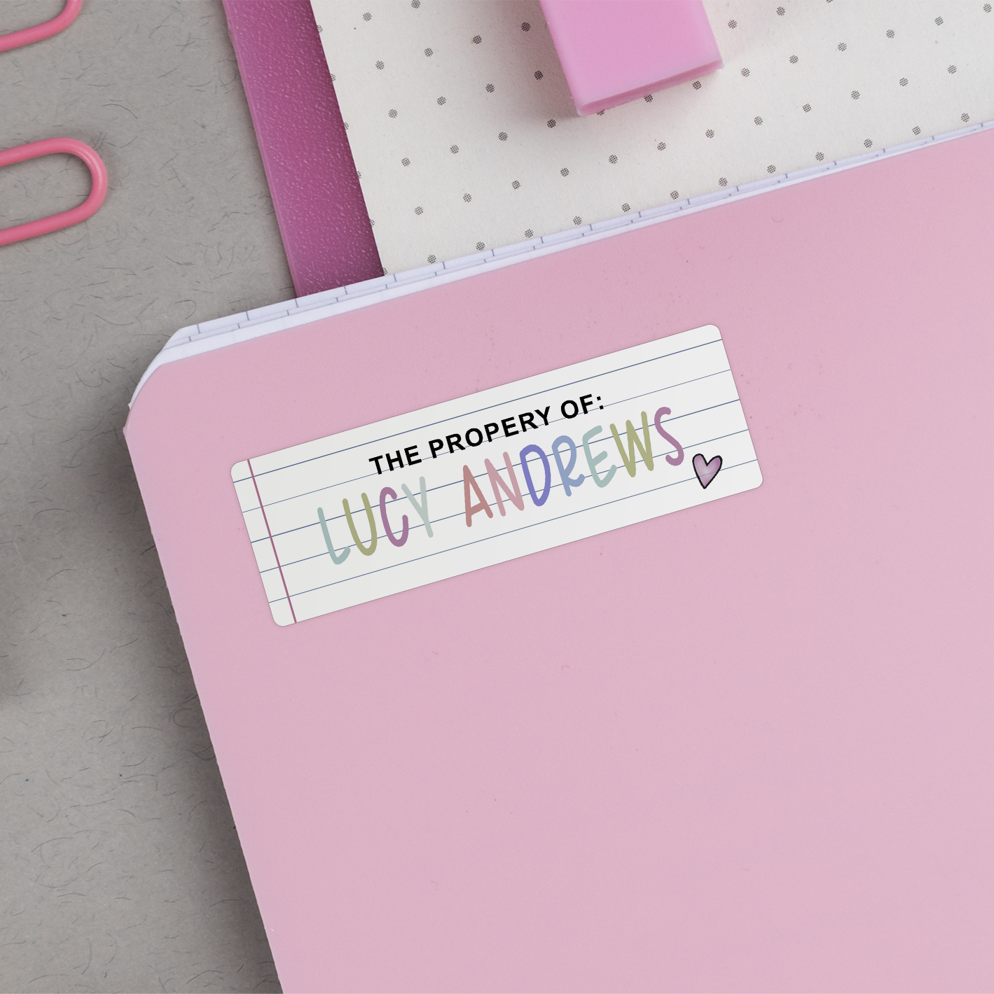 Lined Paper Name Stickers on back of pink notebook